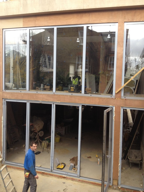Aluminium bi-fold doors with two-storey glazing in Thamesmead