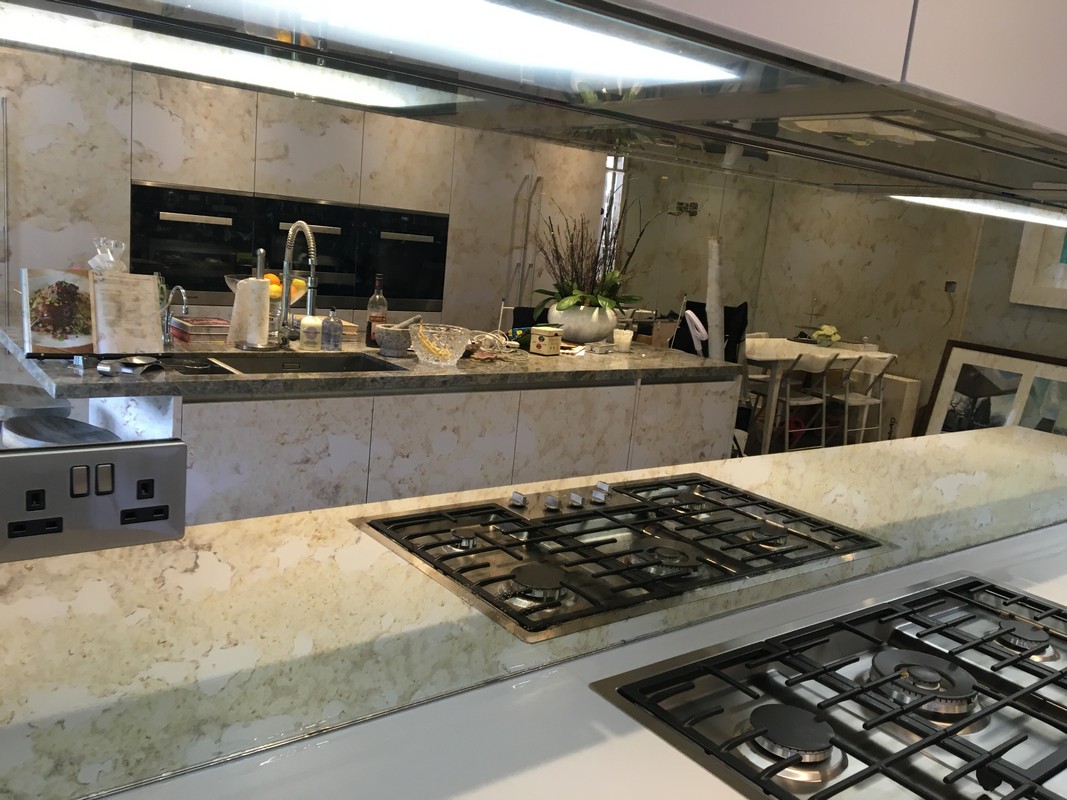 Mirror glass splashback in Thamesmead luxury kitchen