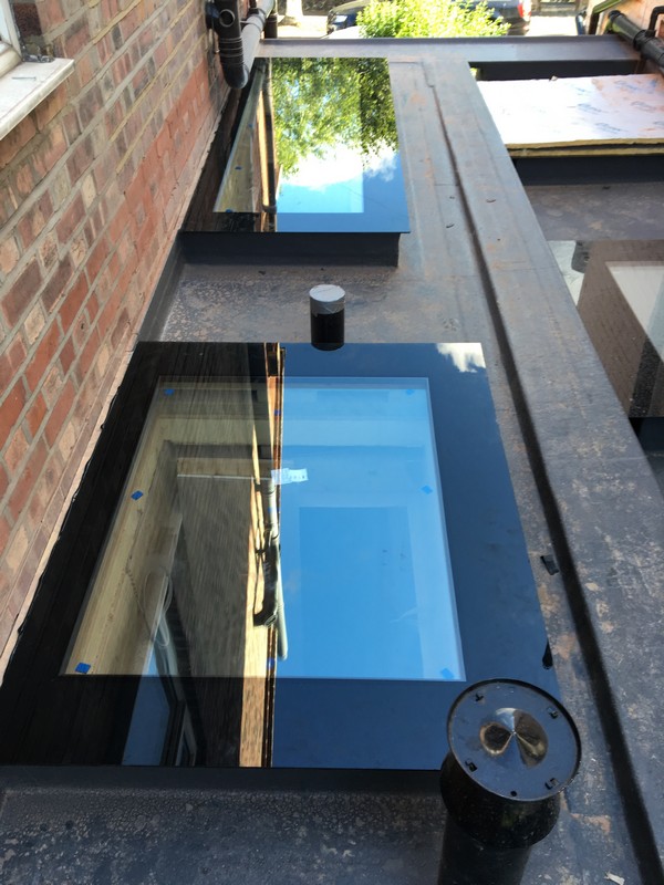Multiple flat roof skylights on extension in Thamesmead